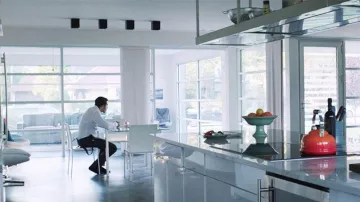 The white chairs Modloft in the dining room of Davis (Jake Gyllenhaal) in Demolition