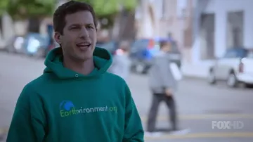 The green t-shirt Earthvironment of Jake Peralta (Andy Samberg) on Brooklyn Nine-Nine S03E07