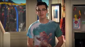Old Skool Hooligans Goodie Two Sleeves Pizza Surfing Cat T Shirt worn by Joey Rooney (Joey Bragg) in Liv and Maddie (S04E10)