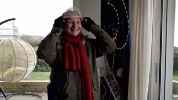 The red sash worn by Captain Marleau (Corinne Masiero) in Captain Marleau (S02E06)