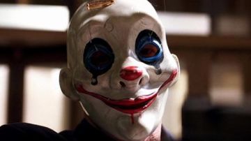 The clown mask worn by Happy (William Smillie) in The Dark Knight : The ...