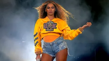 BΔK crop top hoodie in yellow worn by Beyoncé as seen in Homecoming: A Film by Beyoncé