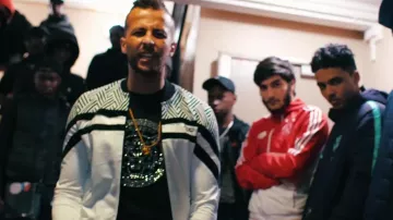 The white jacket and grey Project X Paris Hayce Lemsi in her video clip Jean Reno