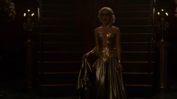 The dress in gold as worn by Sabrina Spellman (Kiernan Shipka) in The New Adventures of Sabrina S02E09