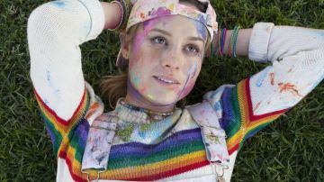 White sweater with rainbow stripe worn by Kit (Brie Larson) in Unicorn Store