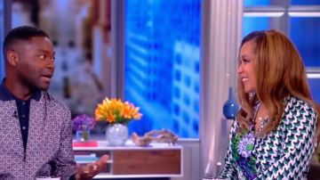 Rixo  Betty Floral & Houndstooth Print Wrap Dress worn by Sunny Hostin on The View April 12, 2019