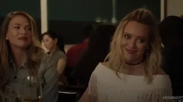 Jonathan Simkhai Fringed off-the-shoulder woven top worn by Kelsey Peters (Hilary Duff) in Younger (S03E02)