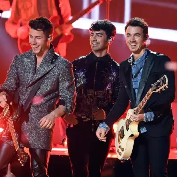 Balmain embossed button blazer worn by Kevin Jonas  for Billboard Music Awards May 1, 2019
