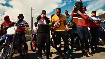The sweat pants Ferrari x Puma worn by Alonzo in her video clip On The Motorcycle feat. JUL