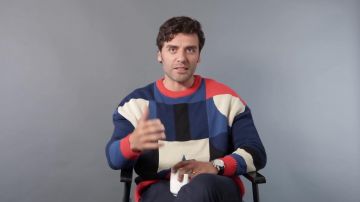 Henrik Vibskov Goodman Colorblock Sweater worn by Oscar Isaac in Os­car Isaac Breaks Down His Most Iconic Char­ac­ters by GQ