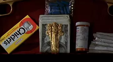 L'authentique pince à billets "3 Dragons" de Castor Troy (Nicolas Cage) dans Volte/Face