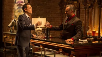 The bottle of Quintessentially Q Vodka Michael Nyqvist and Dean Winters in John Wick