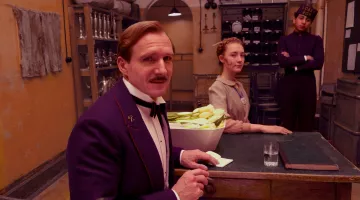 The pin crossed keys of Mr. Gustave (Ralph Fiennes) in The Grand Budapest Hotel