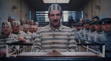 The holding of a prisoner of M. Gustave (Ralph Fiennes) in The Grand Budapest Hotel