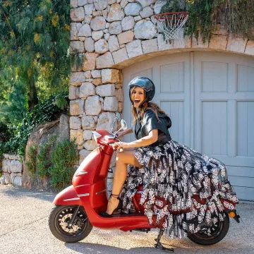 The black long dress with printed feathers worn by Laury Thilleman at the rise of the steps may 17, 2019 at the Cannes film Festival