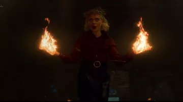 Black skirt and red shirt worn by Sabrina (Kiernan Shipka) in Chill­ing Ad­ven­tures of Sab­rina S02E06