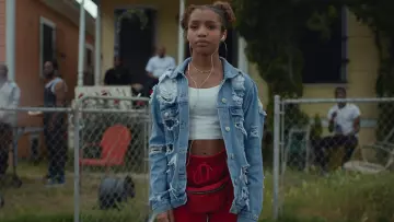 The jogging pants with red worn by a teenage girl in the video clip, the Old Town Road of Lil Nas X feat. Billy Ray Cyrus