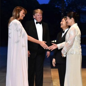 J. Mendel  White nude long dress with feathers worn by Melania Trump at the Imperial Palace in Tokyo May 26, 2019