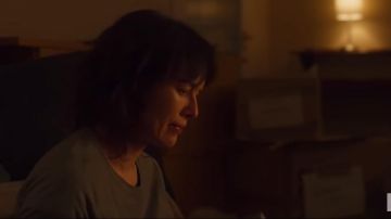 The gray sweater worn by Wendy (Lena Headey) in the trailer of the movie The Flood