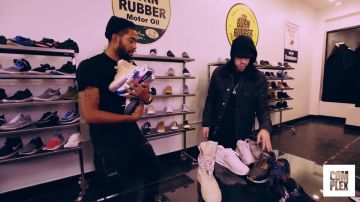 Black coat worn by Eminem in Em­inem Goes Sneaker Shop­ping With Com­plex YouTube video