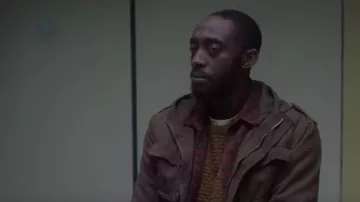 The brown jacket dark Haile (Ivanno Jeremiah) in The Flood