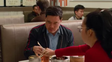 The bomber jacket blue with stripes red on the side worn by Marcus (Randall Park) in Always Be My Maybe