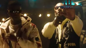 La chaqueta táctica negra Human With Attitude que lleva Vegedream en su clip Ella es buena su hazaña madre. Ninho