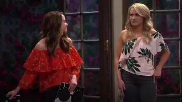 Alice + Olivia Stace Face Embellished Large Zip Pouch worn by Sofia Rodriguez (Aimee Carrero) in Young & Hungry (S05E15)