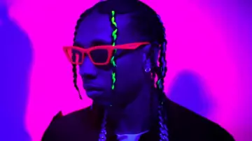 Pink small sunglasses worn by Tyga in his Haute music video feat. J Balvin, Chris Brown