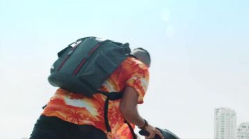 The orange shirt pattern worn by Naps in her video clip, It Is Made For That