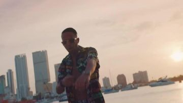 The sunglasses lenses and black frame gold worn by Naps in her video clip, It Is Made For That