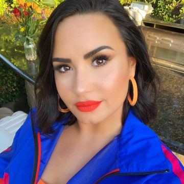 Alison Lou Neon Medium Jelly Hoops Loucite worn by Demi Lovato on her Instagram account @ddlovato