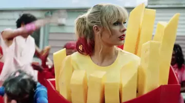 Yellow t-shirt worn by Taylor Swift as seen in her You Need To Calm Down music video