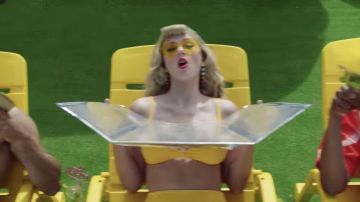 l­low Heart-Shaped Sun­glasses worn by Taylor Swift as seen in her You Need To Calm Down music video