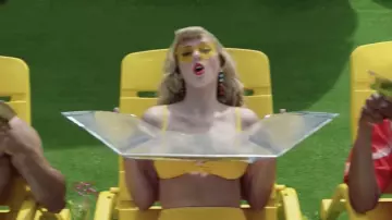 l­low Heart-Shaped Sun­glasses worn by Taylor Swift as seen in her You Need To Calm Down music video