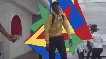The sweatshirt yellow Daily Paper carried by MHD in her video clip Bodyguard