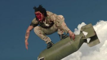 Black military boots worn by Trippie Redd as seen in his Under Enemy Arms music video