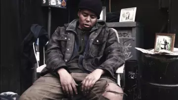 Green long sleeves t-shirt with grandad neck worn by YBN Cordae in his official music video Bad Idea (feat. Chance The Rapper)