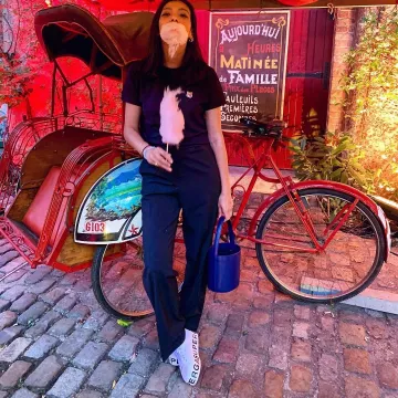Sneakers, white platform shoe with logo Superga Mina Soundiram June 21, 2019 at the Musée des Arts Forains