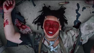 Silver necklace with a monster pendant worn by Trippie Redd as seen in his Under Enemy Arms music video