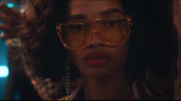 Orange transparent sunglasses worn by an extra as seen in Bond 25 trailer