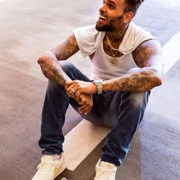 White and Gold Nike Air Force 1 worn by Chris Brown on the Instagram account of @chrisbrownofficial