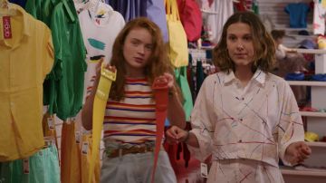 The white shirt printed jets of paint worn by 11 / Eleven (Millie Bobby Brown) in Stranger Things (S03E02)