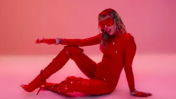 Red Boots with high heels and lace worn by Miley Cyrus in her Mother's Daughter music video