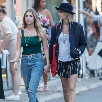 Saint Laurent Teddy Bomber Jacket In Navy worn by Cara Delevingne With Ashley Benson July 6, 2019