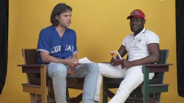 Le polo blanc Kenzo avec logo tigre porté par Kery James dans  la vidéo Orelsan & Kery James se répondent - À qui la faute ?