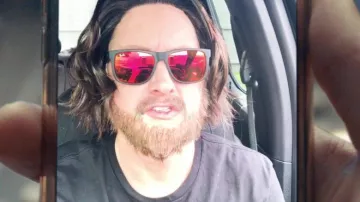 Orange reflective Ray-Ban sunglasses worn by Chris D'Elia as seen in Homicide music video by Logic feat. Eminem