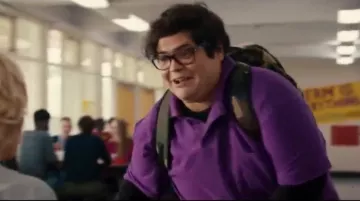 Purple Polo T Shirt worn by Lonnie Gregory (Harvey Guillén) in Status Update
