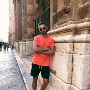 Smock Man orange t-shirt with screenprint text worn by Kevin Berru on the Instagram account @kevinberruuu