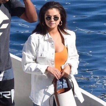 Tropic of C Bo Swimsuit In Saffron worn by Selena Gomez Italy July 24, 2019
